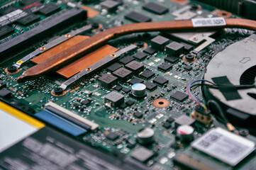 Close up of laptop processor with empty socket base for CPU and integrated graphics card on main...