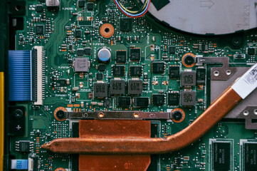 Electronic components on a computer graphics card. Bitcoin Cryptocurrency coin on a PC computer...