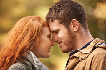 Outdoor, date and couple with love in nature on holiday adventure or relax together on vacation in woods. Happy, man and woman in park with smile for romantic connection in marriage and enjoy forest