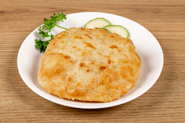 An Indian snack, Puri, a deep fried snack bread, sometimes stuffed as Dhal Puri
