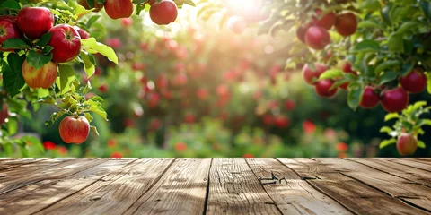 Möbelaufkleber Empty wooden kitchen table over apple fruit garden background © Ricardo Costa