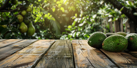 Empty wooden kitchen table over avocado fruit garden background