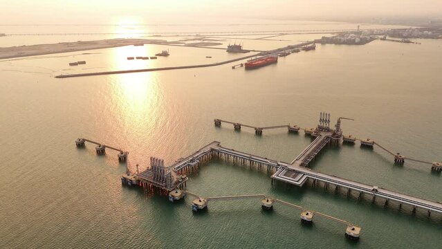 LNG (Liquified Natural Gas) tank at Gas terminal gas tanks for storage sea port. 
