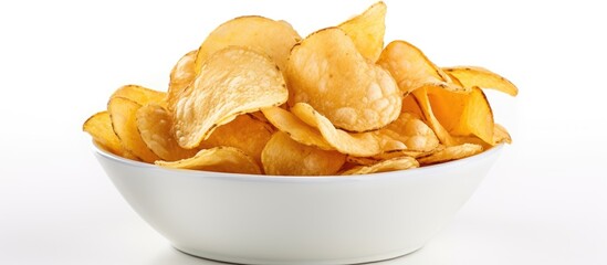 A bowl filled with potato chips placed on a white surface