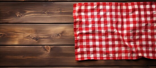 Red and white checkered tablecloth on wooden table