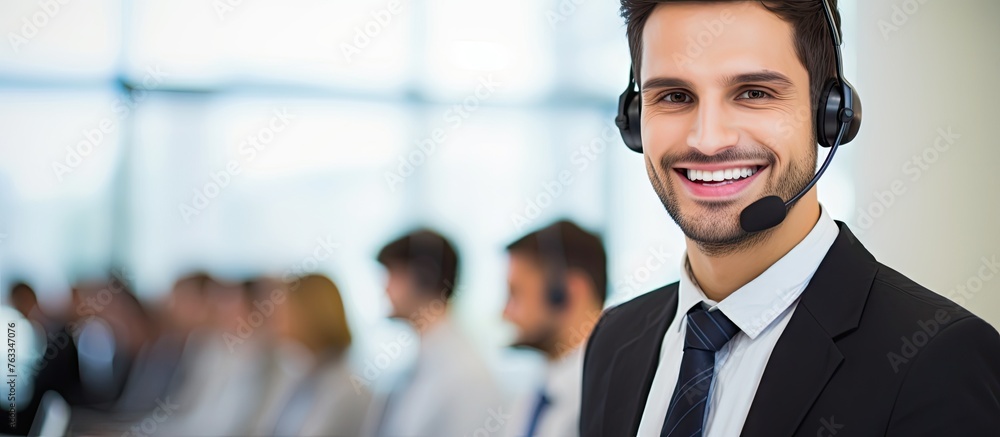 Poster smiling man in suit with headset working in call center