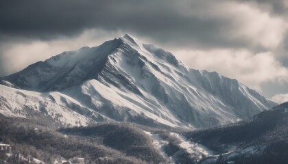 Fototapeta na wymiar Mountain covered in snow under a cloudy sky