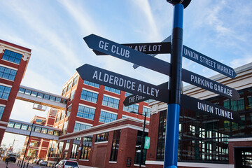 Urban Signpost with Modern Architecture, Blue Sky Background