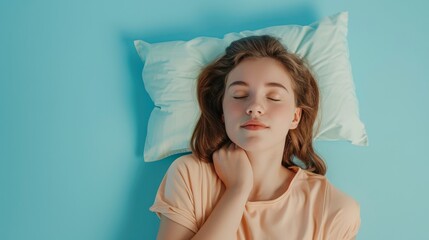 a young woman sleeping on pillow isolated on pastel blue colored background. Girl sleep deeply peacefully rest. Top above high angle view photo portrait of satisfied .senior wear orange shirt