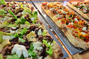 Italian typical specialty food pizza on display close up view