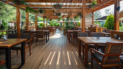 Restaurant covered summer terrace concept with tables, chairs and wooden floor.