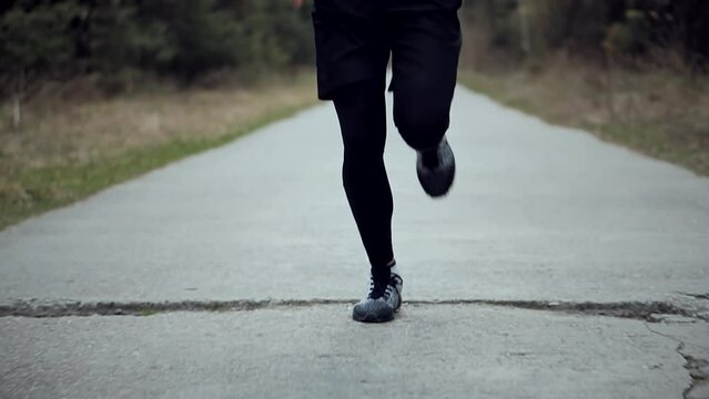 Triathlete training for running competition, sprinting and endurance workouts	