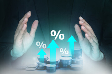 Interest rate increasing concept; Percentage symbol and arrow up sign with stack of coins