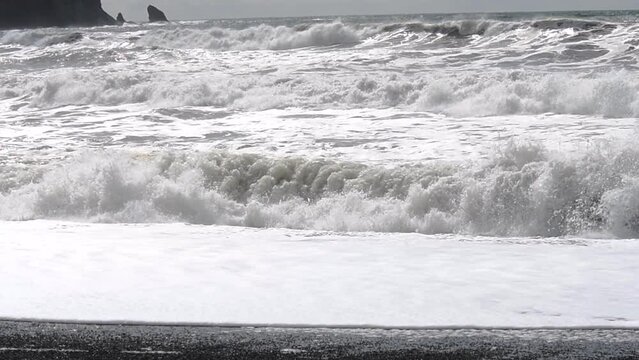 Slow Motion of crashing Pacific Ocean waves on Rialto Beach near La Push, Washington, and Mora Campground in the Olympic National Forest; Washington, United States of America