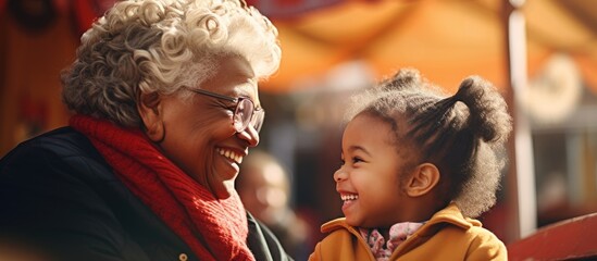 woman and child smiling on park bench