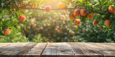 Raamstickers Empty wooden kitchen table over peach fruit garden background © Ricardo Costa