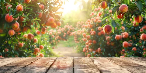  Empty wooden kitchen table over peach fruit garden background © Ricardo Costa