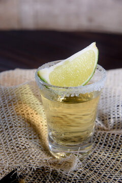 shot of tequila Brazilian cachaça distilled alcohol drink with lemon image