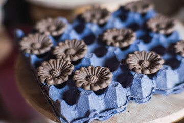 Clay flowers, pieces to make a traditional tree of life, typical Mexican crafts.