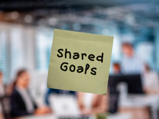 Post note on glass with 'Remote Team Morale'.