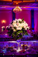 Lavish floral centerpiece arrangement in evening reception hall