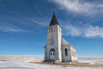Abandoned church in the Canadian prairies on a harsh winter landscape; Admiral, Saskatchewan, Canada