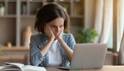 Young woman looking at laptop screen in despair, unemployed female looking through job hunting sites unsuccessfully, frustrated female freelancer fails  - obrazy, fototapety, plakaty