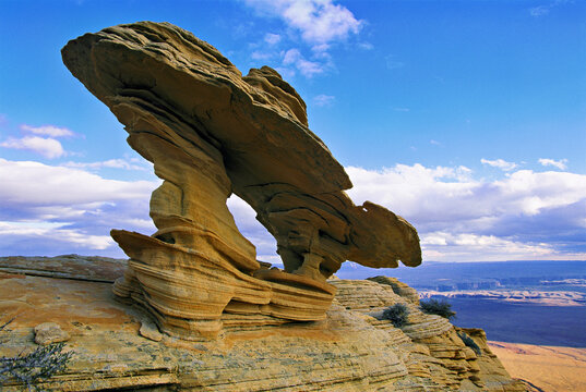 Rock formation shaped by wind erosion overlooks the Grand Canyon