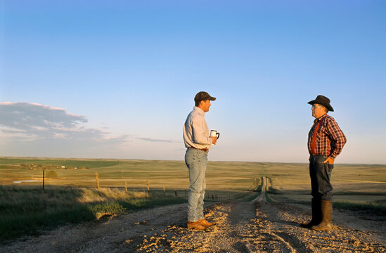 Father and son work on their ranch; Howes, South Dakota, United States of America