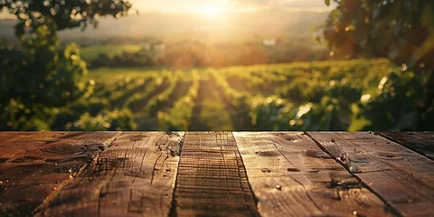 Fotobehang Wood table top on blurred vineyard landscape background © Ricardo Costa