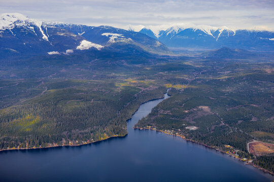 Scenic view of coastline and snow-capped mountains on flight from YVR Vancouver to Terrace, BC; Vancouver, British Columbia, Canada