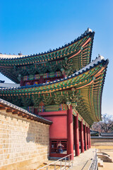Fototapeta na wymiar Donhwamun Gate Changdeokgung Palace, March 2st2024 photo of the main gate of Changdeokgung, Wooden Design is located in Seoul, South Korea.