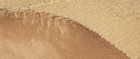 Clear sea wave, golden sand beach, Baltic crystal clear water in close up, summer holidays backdrop, relaxing rest banner design template, copy space