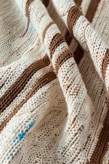 A close up picture of a kitchen towel cloth with orange and brown striped lines texture and pattern, AI Generated.