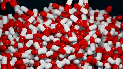 Red capsules, medical pills falling into a box. Industrial production of medicine, antibiotics or other drugs. - Powered by Adobe