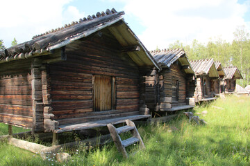 Fototapeta na wymiar Old village with wooden houses in Sweden. Abandoned village