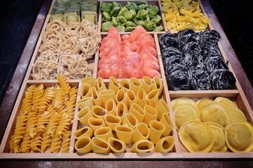 variety of different shapes of italian fresh handmade raw pasta