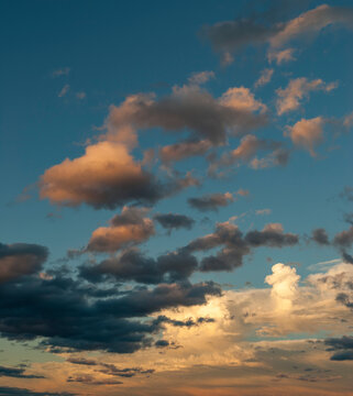 Dramatic view of multi colored clouds in a blue sky at sunset; United States of America