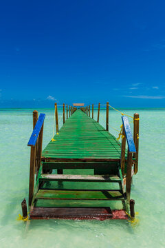 Pier of a hotel at Cayo Guillermo in the Jardines del Rey archipelago, with clear turquoise water and the horizon in the distance; Cayo Guillermo, Cuba