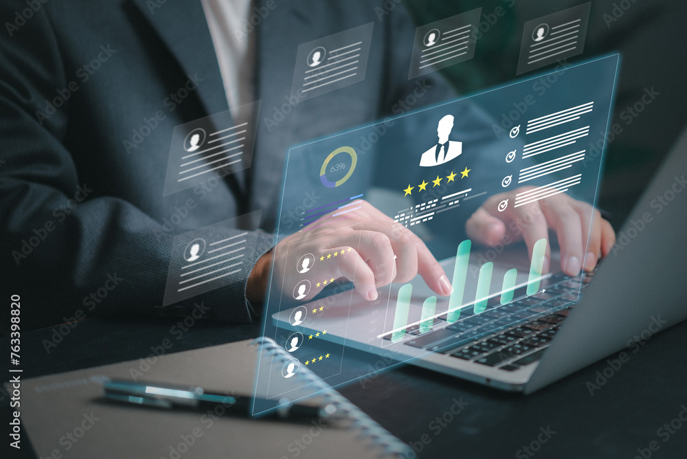 Poster a man is typing on a laptop with a screen displaying a graph of people ratings employee-kpi dashboar