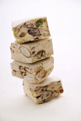 pieces of nougat with walnuts and white chocolate