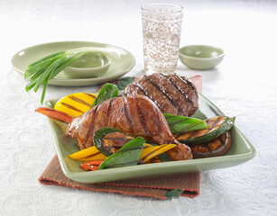 Grilled chicken, beef burger patty with grilled vegetables