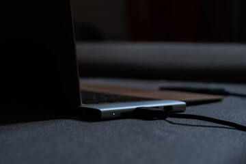 Close-up laptop, type-c hub with cable and usb receiver. Black background. place for inscription...
