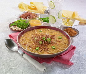 Haleem, Daleem or also called Hareesa in Punjab and Kashmir regions. It is bunch of grains, lentils, beans, meat and many other spices and then cook over night until it properly mash.