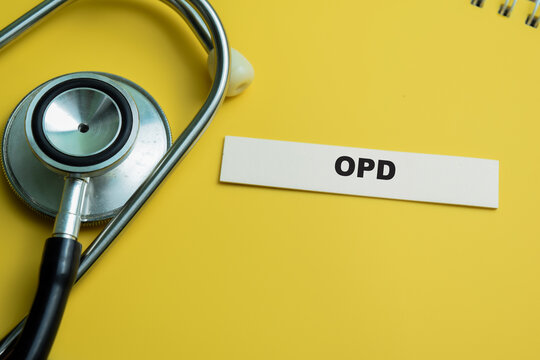 Concept of OPD write on sticky notes isolated on Wooden Table.