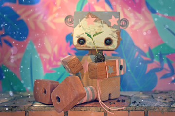 Robot de madera con brote de planta en su mano - obrazy, fototapety, plakaty