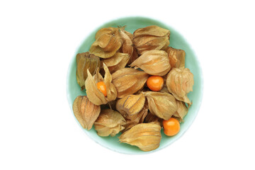 Physalis peruviana fruit on mint plate isolated on white background.