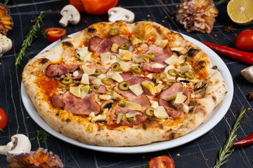 tasty italian capricciosa pizza with fresh ingredients