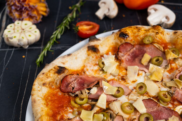 tasty italian capricciosa pizza with fresh ingredients