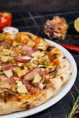 tasty italian capricciosa pizza with fresh ingredients